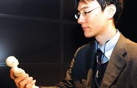 ... researcher Takashi Minato displays a human-shaped mobile phone. - b82fbf6c26dd6cf76046f1d496f5fb95554185856-1302214331-4d9e36bb-620x348