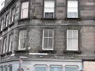 All wise ladies collect blue coupons. Faded painted adverts on the corner of - via Daymix