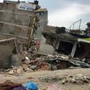 Buildings collapse, at least two killed as 7.9 quake hits Nepal.