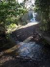 The stream being forded rises near Long Park only 400 metres away, - via Daymix