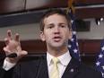 Aaron Schock gestures during a