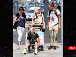 Image result for Queen B by Bumbleride $428 Gwen Stefani and Gavin Rossdale with Kingston and Zuma at the LA zoo