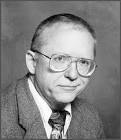 JOHN L. HALL