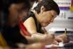 Maria De Jesus Esparza Castillo, 57, works on a writing exercise during a ... - scaled.002_SPANISH_t198