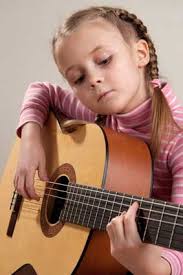Kid taking acoustic guitar lessons in Box Hill - Melbourne Children can be started successfully on guitar at 7 – 8 years but must be directed differently to ... - kids-acoustic-guitar-lessons-melbourne
