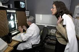 Gloria Wright/Post-Standard, file photo, 2005Dr. Kara Kort looks over the shoulder of radiologist Dr. Joseph Scrivani at the results of her first mammogram ... - kortmammogram2gjwjpg-0c1309237f740a1a_large