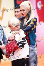 Image result for Queen B by Bumbleride $428 Gwen Stefani and Gavin Rossdale with Kingston and Zuma at the LA zoo