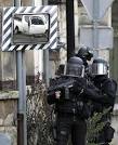 Armed police scour forest as Charlie Hebdo shooting suspects hide.