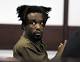 Wives weep as footage of suspected cop killer's double slaying plays in court