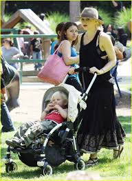 Image result for Queen B by Bumbleride $428 Gwen Stefani and Gavin Rossdale with Kingston and Zuma at the LA zoo
