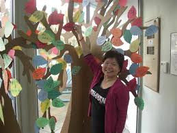 Roseanne Law of Volunteer Richmond\u0026#39;s Child Care Resource \u0026amp; Referral Centre adds a leaf to the VolunTREE. - Press_Release.sflb