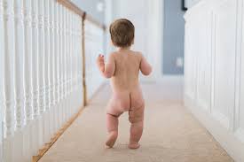 toddler naked|Portrait of a naked toddler playing in the hamper - SuperStock