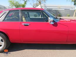 Image result for Sebring Red 1986 Jaguar