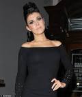 Kym Marsh steps out on towering heels for night with sister Tracey.