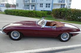 Image result for Maroon 1962 Jaguar