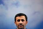 Ahmadinejad gestures as he