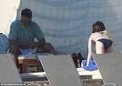 Bikini clad Eliza Dushku looks out to sea but boyfriend Rick Fox