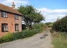 Dodgers Lane past Corner Cottage. The lane links The Street with Cooke's - via Daymix