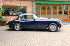 Image result for Silver Blue 1959 Jaguar