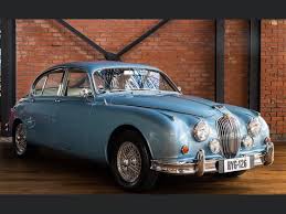 Image result for Silver Blue 1959 Jaguar