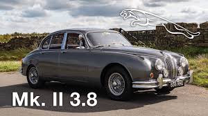 Image result for Maroon 1962 Jaguar