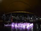 Wembley: fountain, trees and stadium by night - via Daymix