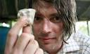 Alex James holds a lump of