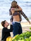 Kristen Stewart forgoes the bikini in a pair of mens Y-fronts.