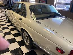Image result for Nimbus White 1987 Jaguar