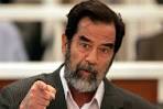 Saddam Hussein speaks to Presiding Judge Rizgar Mohammad Amin as ... - 749514-3x2-940x627