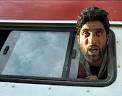 A relative of a Kashmiri man, Shabir Ahmad, weeps from the window of an ... - 25sld5