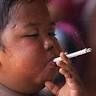 Jakarta, 21 March 2012 (MIA) - Eight-year-old Adi Ilham's habit, ... - smoke_cigarete