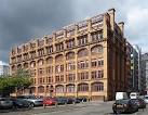 Cast-iron frame, Art Nouveau-ish windows, and a rhythmic arcade of giant - via Daymix