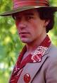 Phil Hartman in character as
