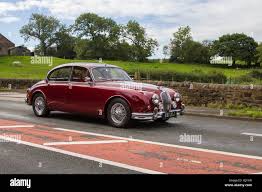 Image result for Maroon 1962 Jaguar