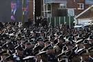 Photos: Thousands turn out to pay their respects at NYPD officers.