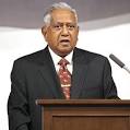 S R Nathan looking at things