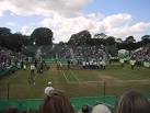 playing grass court tennis - via Daymix