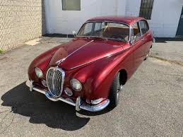 Image result for Burgundy 1983 Jaguar