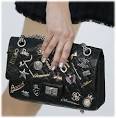 http://cdn.purseblog.com/images/chanel_charm_255_handbag_spring_2007.jpg