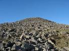 The 6m high and 30m diameter Carnguwch cairn - via Daymix