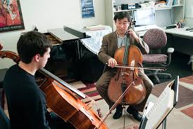 Kangho Lee, associate professor of music, teaches cello in a one-on-one lesson with sophomore Samuel DeCaprio. Photo by Peter Morenus - 1Lee013_lg