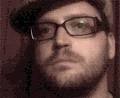 Ken Udut in glasses.