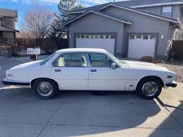 Image result for Nimbus White 1987 Jaguar