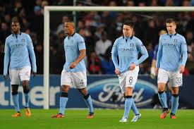 Samir Nasri, Yaya Toure and Vincent Kompany look on after ... - 4385644-3x2-940x627