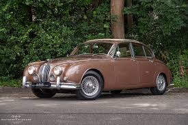 Image result for Maroon 1962 Jaguar