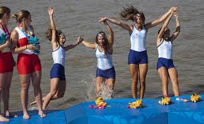 Argentina\u0026#39;s quad skull team from left: Milka Krajev, Maria Abalo, Maria Best, and Maria Rohner jump into the water after winning the rowing gold medal. - bp31