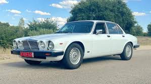 Image result for Glacier White 1988 Jaguar