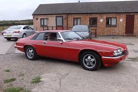 Image result for Sebring Red 1986 Jaguar