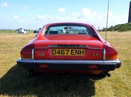 Image result for Sebring Red 1986 Jaguar